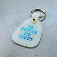 In butter we trust Saddle keychain