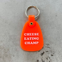 Cheese Eating Champ Saddle keychain
