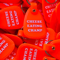 Cheese Eating Champ Saddle keychain