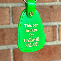 This car brakes for Garage Sales Saddle Keychain