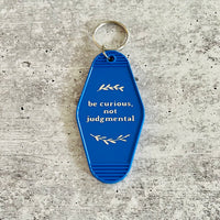 Be curious not judgmental hotel Motel Keychain