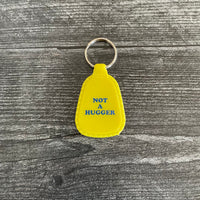 Not a Hugger Saddle Keychain